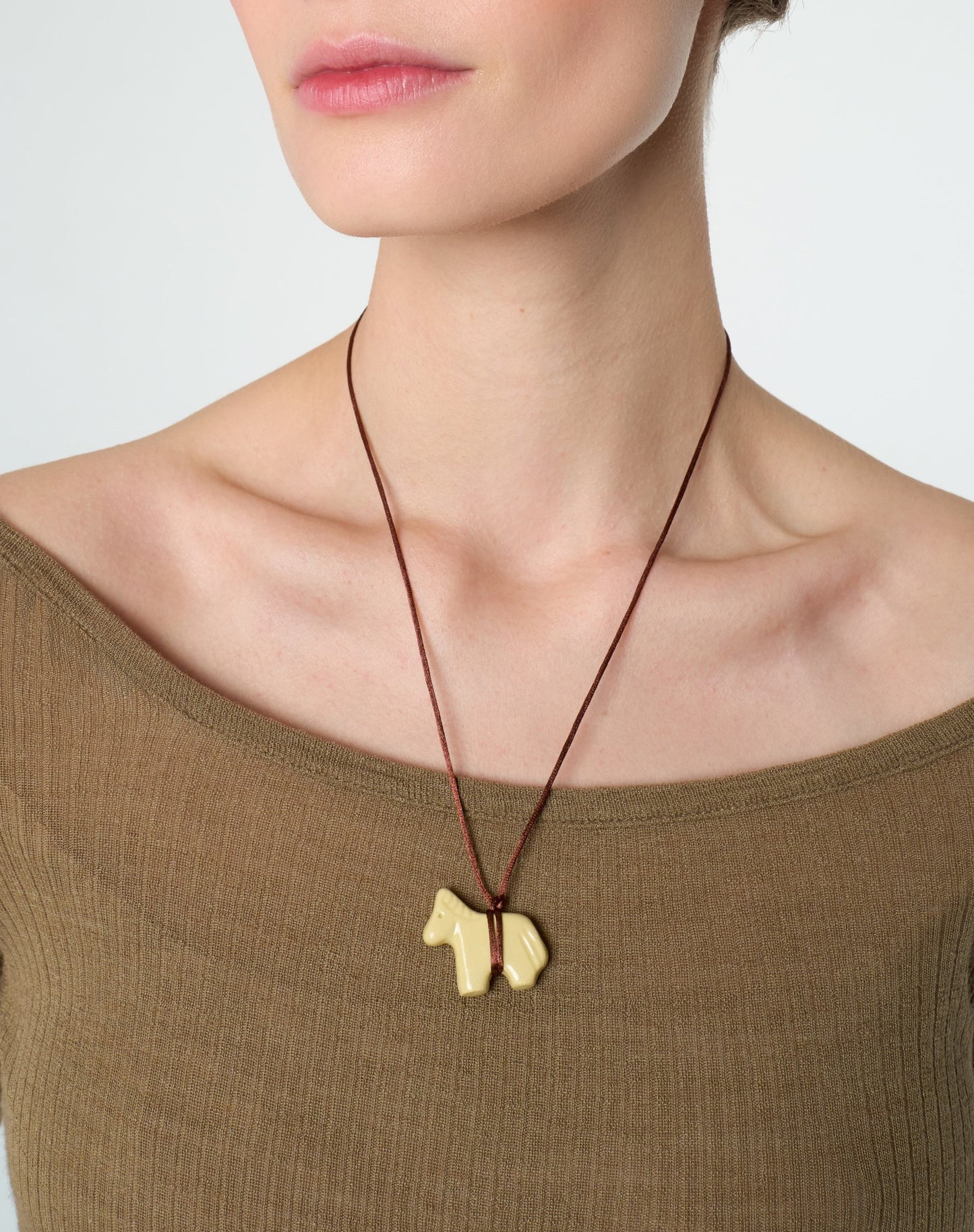 yellow ceramic horse