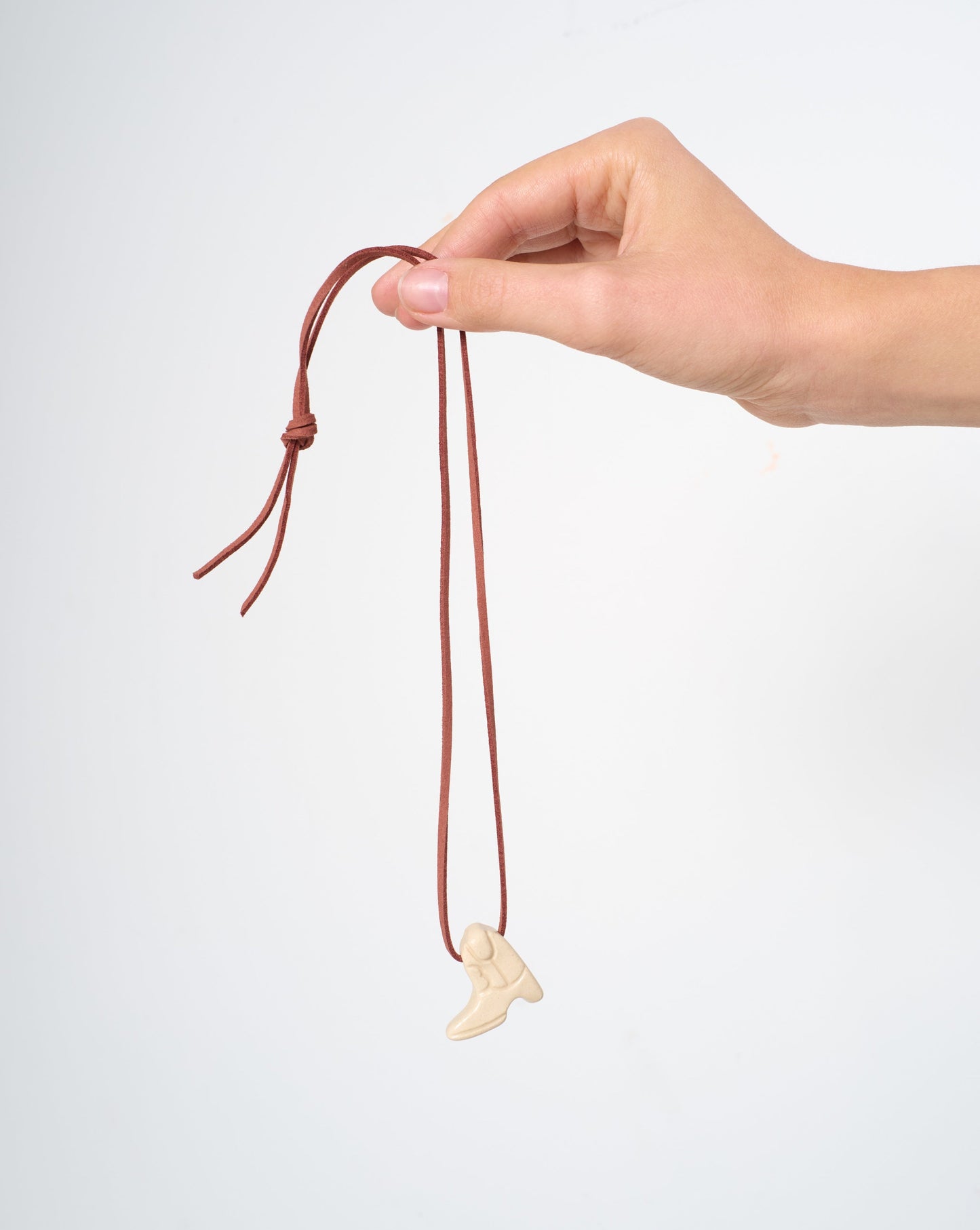 Lucky Cowboy boot ceramic talisman on suede cord